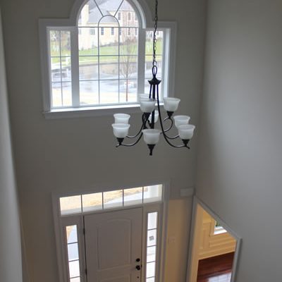 A two story foyer with character & light