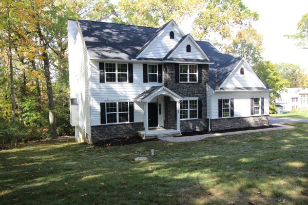 Classic grey stone and white siding compliment each other
