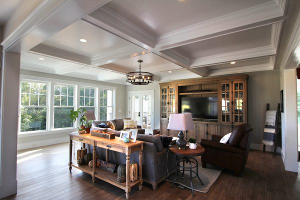 Custom built in cabinetry and a coffered ceiling