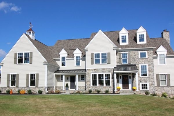 Custom home featuring stone & metal roofs