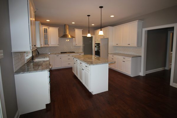 Kitchen with gas cooktop, hood & large island
