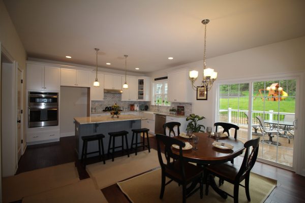 This kitchen's island adds more cabinet space plus the breakfast nook is perfect for a casual meal